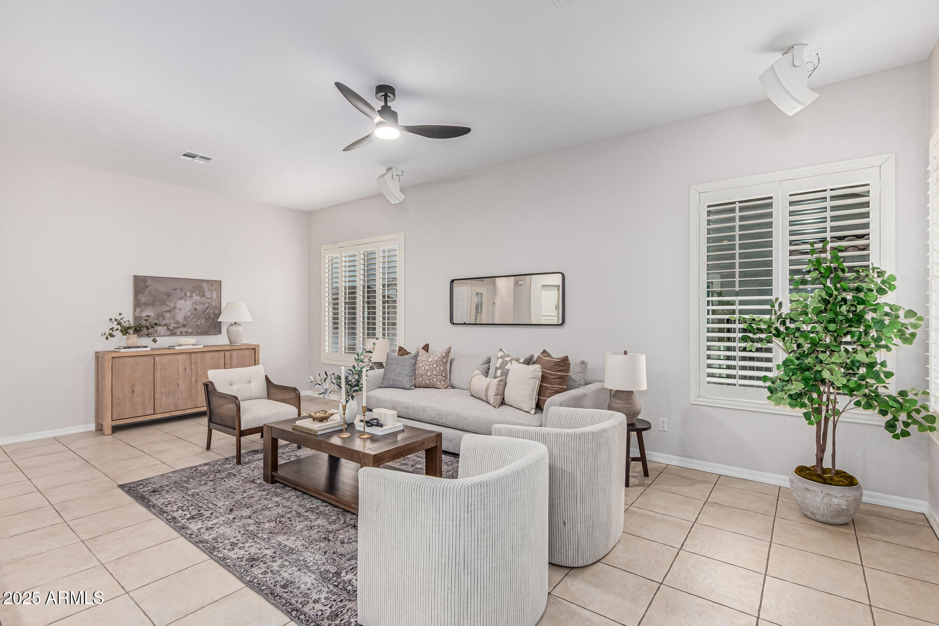 5035 South Ranger Trail Gilbert, AZ 85298 - Photo 6 of 64 a living room with furniture and a potted plant