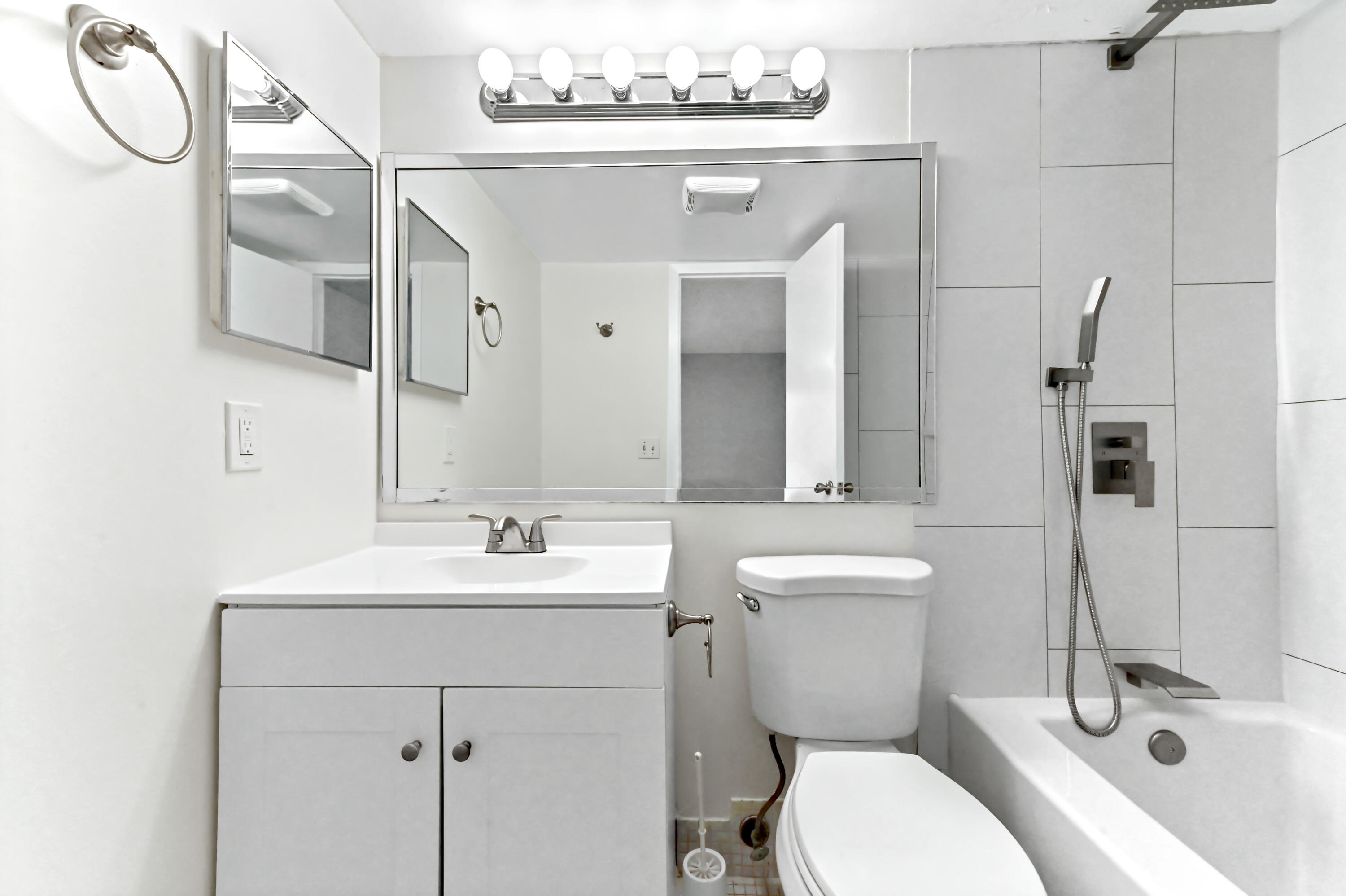 1010 Newcastle A, Unit 1010 Boca Raton, FL 33434 - Photo 18 of 27 a bathroom with a sink toilet and shower
