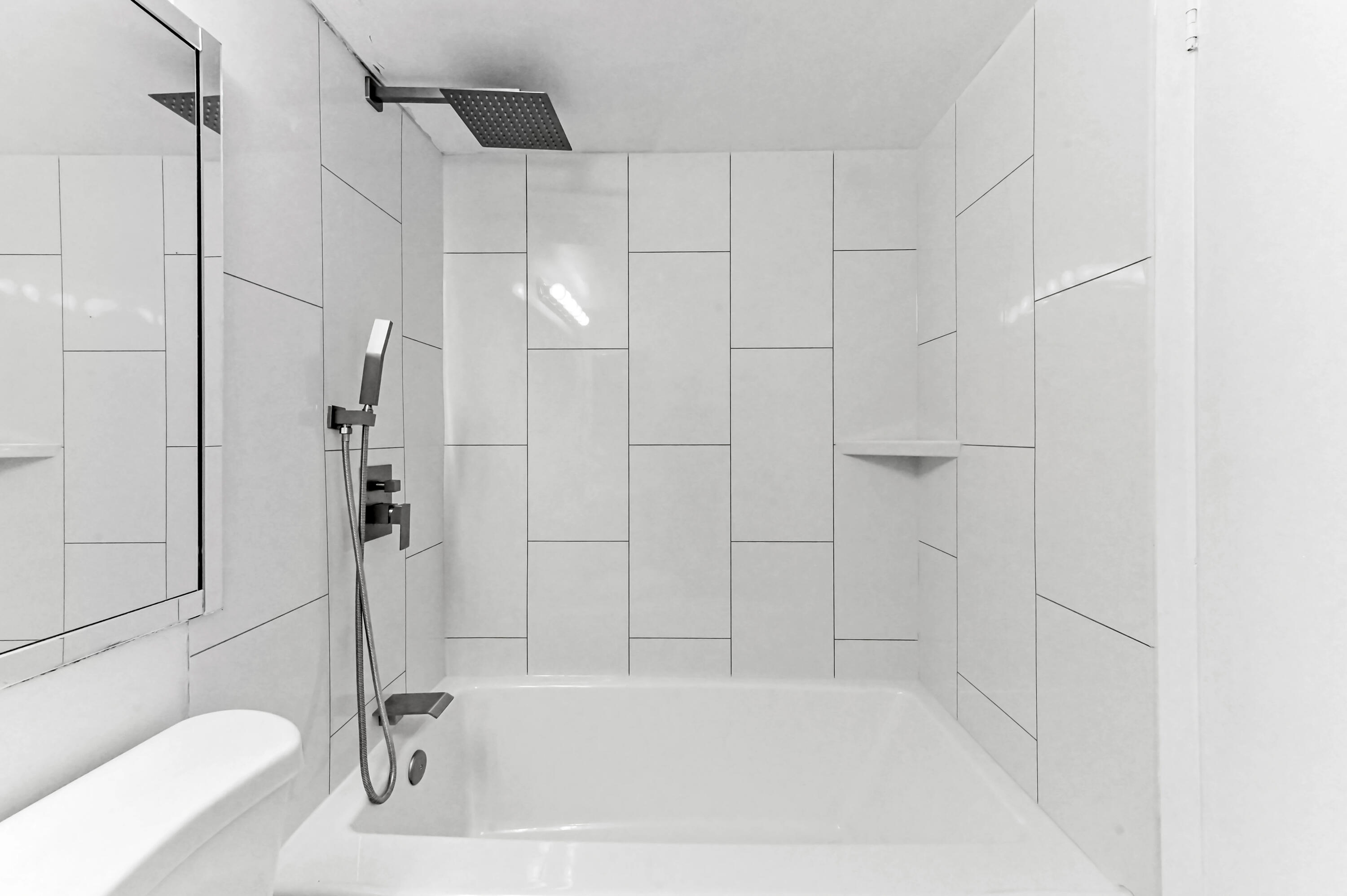 1010 Newcastle A, Unit 1010 Boca Raton, FL 33434 - Photo 19 of 27 a bathroom with a bathtub and a shower