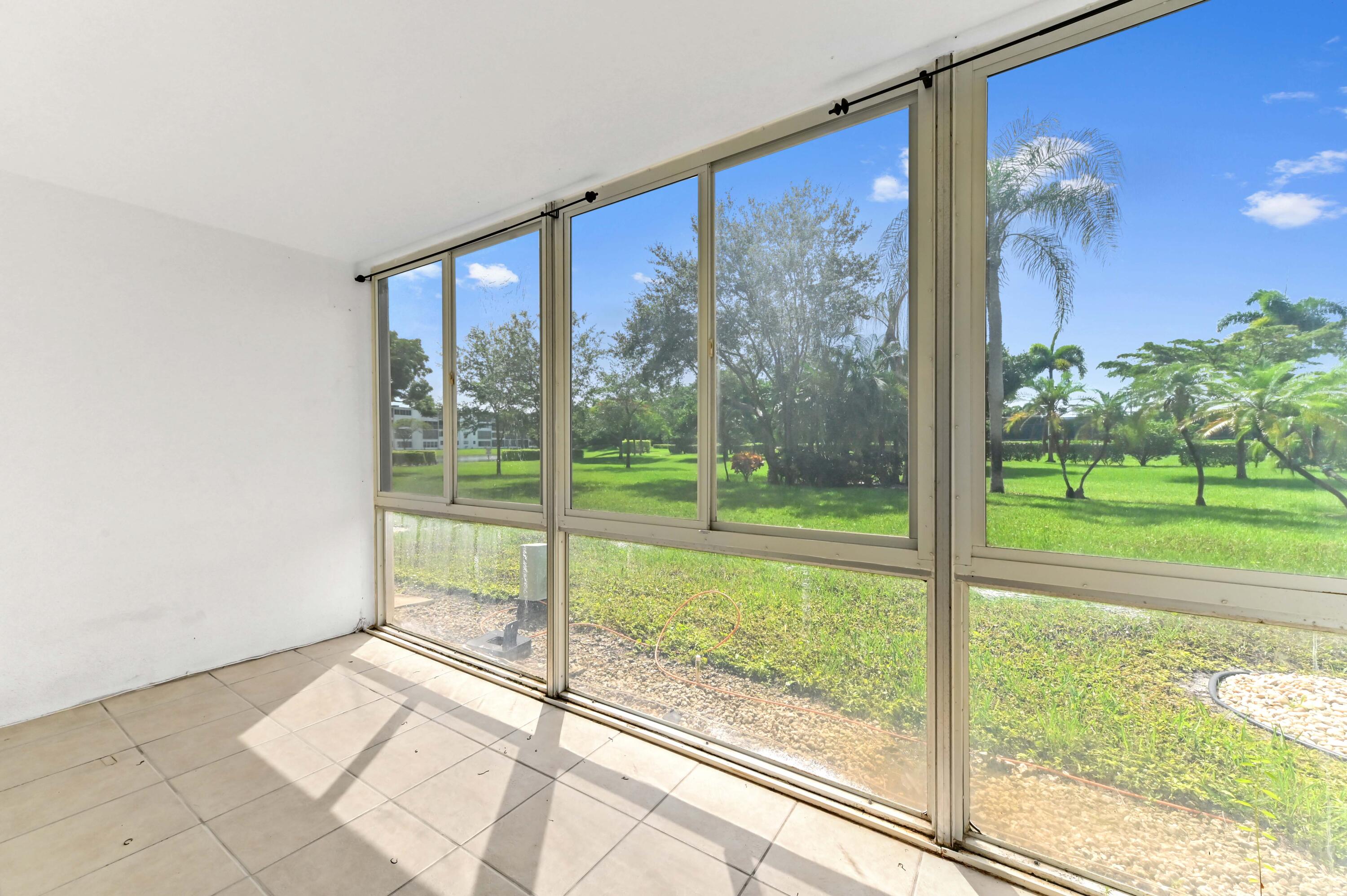 1010 Newcastle A, Unit 1010 Boca Raton, FL 33434 - Photo 21 of 27 a view of a room with a large window