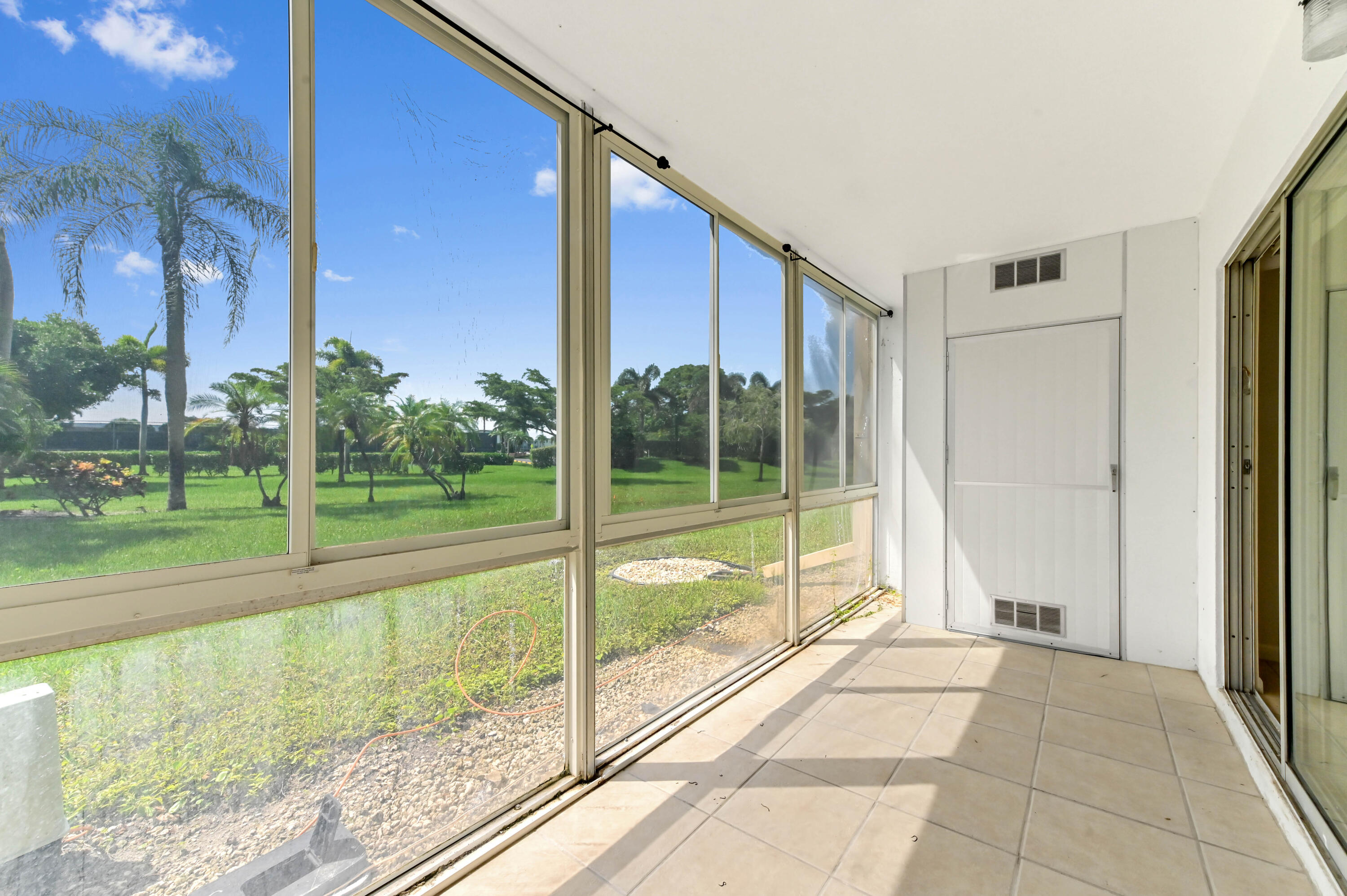 1010 Newcastle A, Unit 1010 Boca Raton, FL 33434 - Photo 23 of 27 a view of a house with a backyard