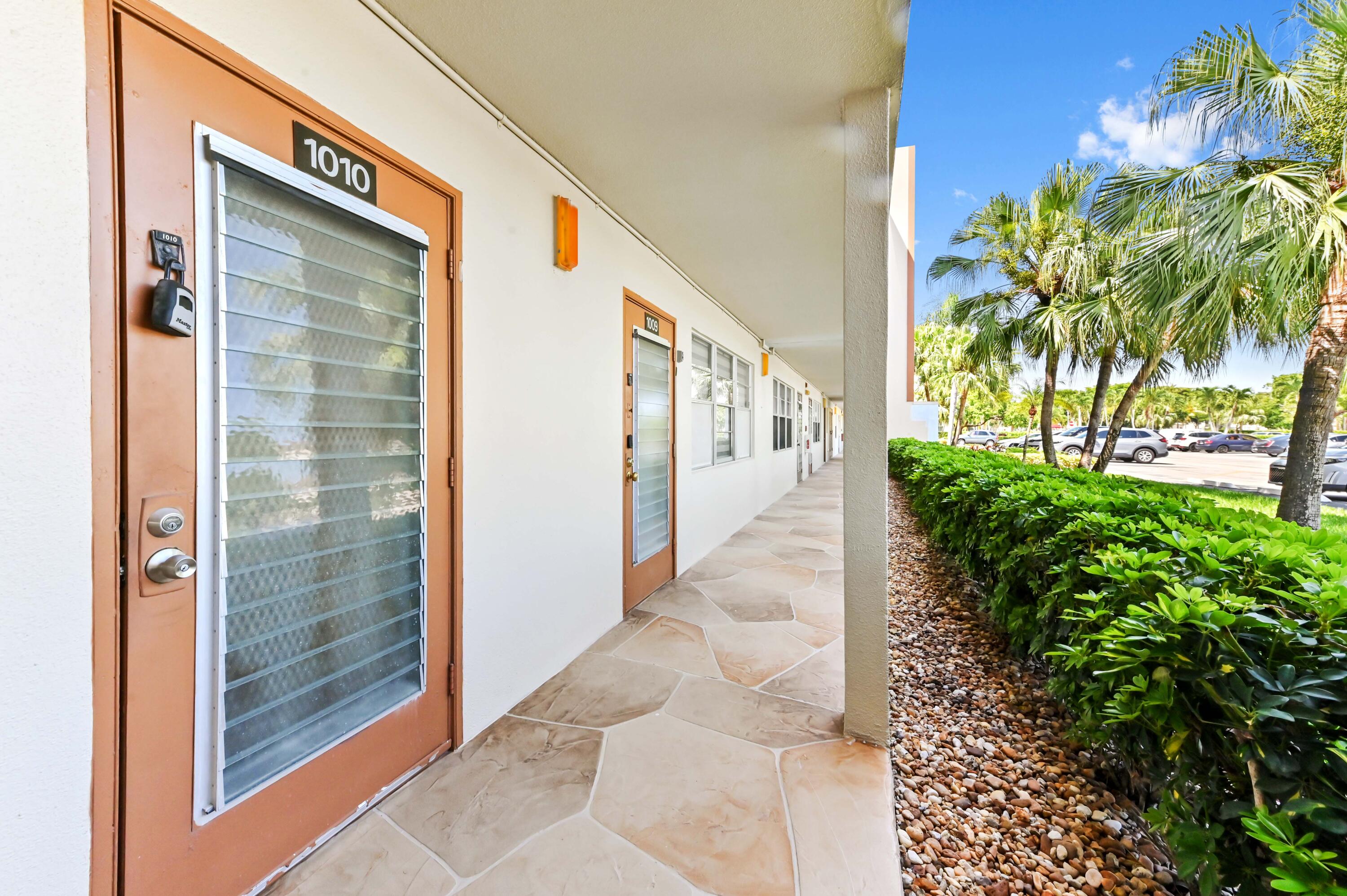 1010 Newcastle A, Unit 1010 Boca Raton, FL 33434 - Photo 27 of 27 a view of a bunch of flowers in front of house