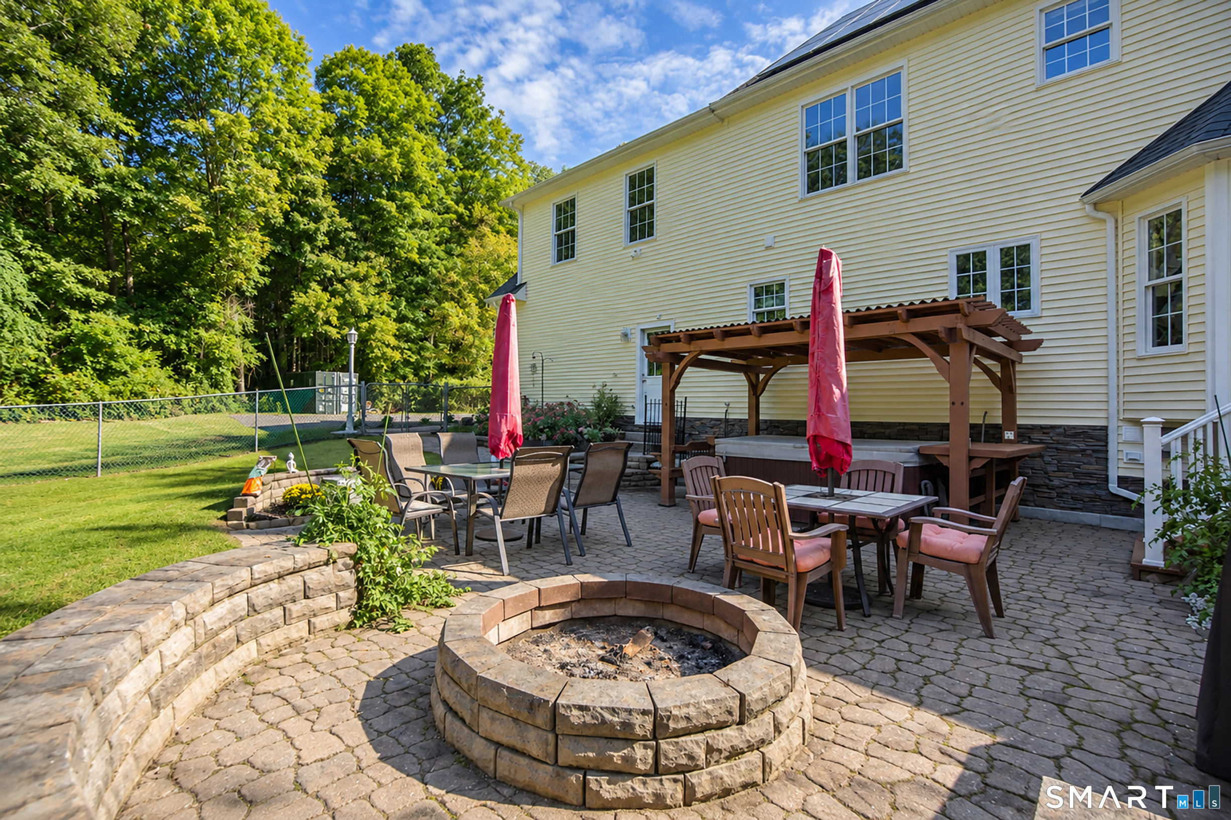 146 Long Hill Road Andover, CT 06232 - Photo 27 of 33 paver patio with fire pit and hot tub