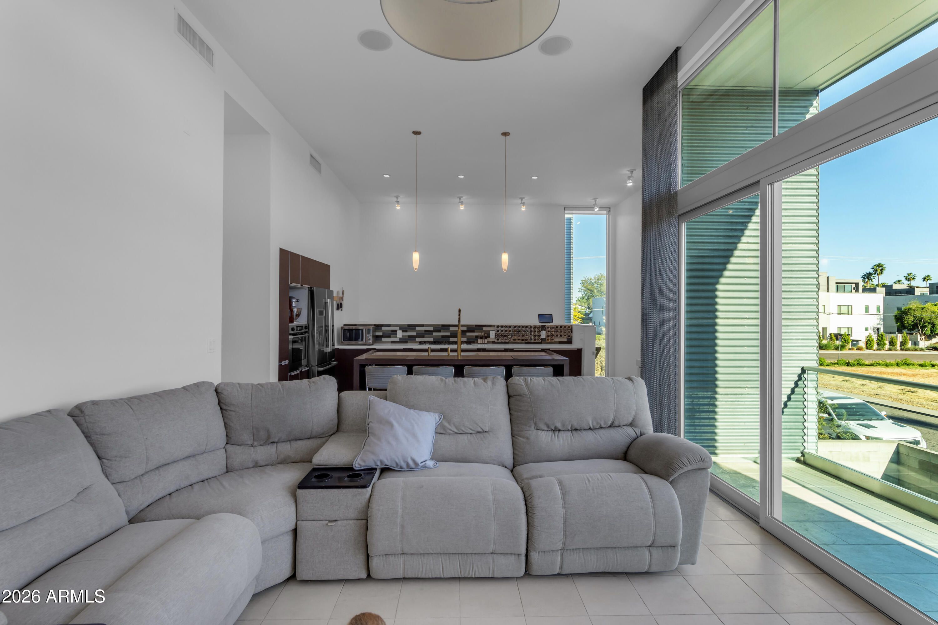 a living room with furniture and a large window