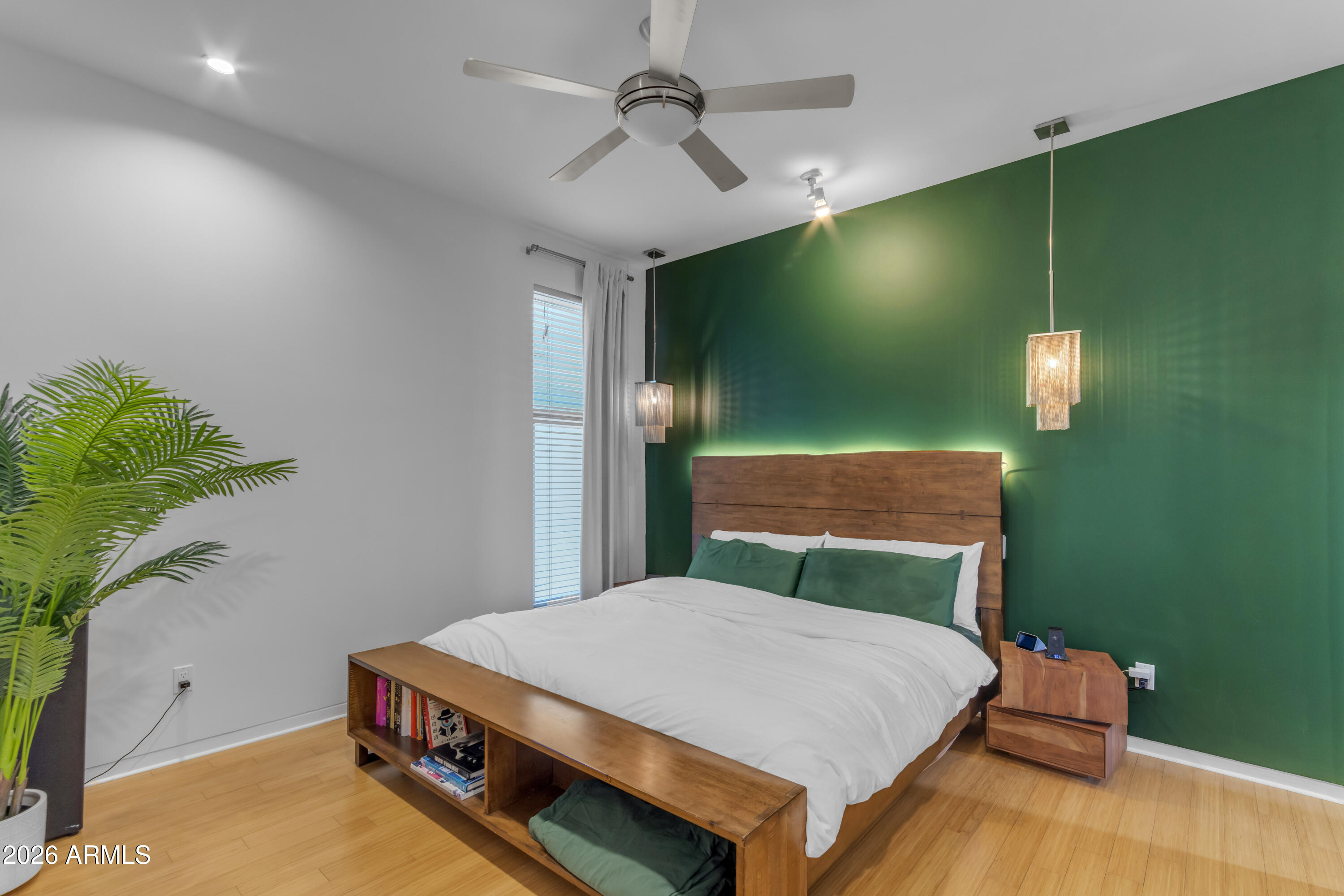 4410 North 27th Street, Unit 6 Phoenix, AZ 85016 - Photo 11 of 48 a bedroom with a bed and a chandelier