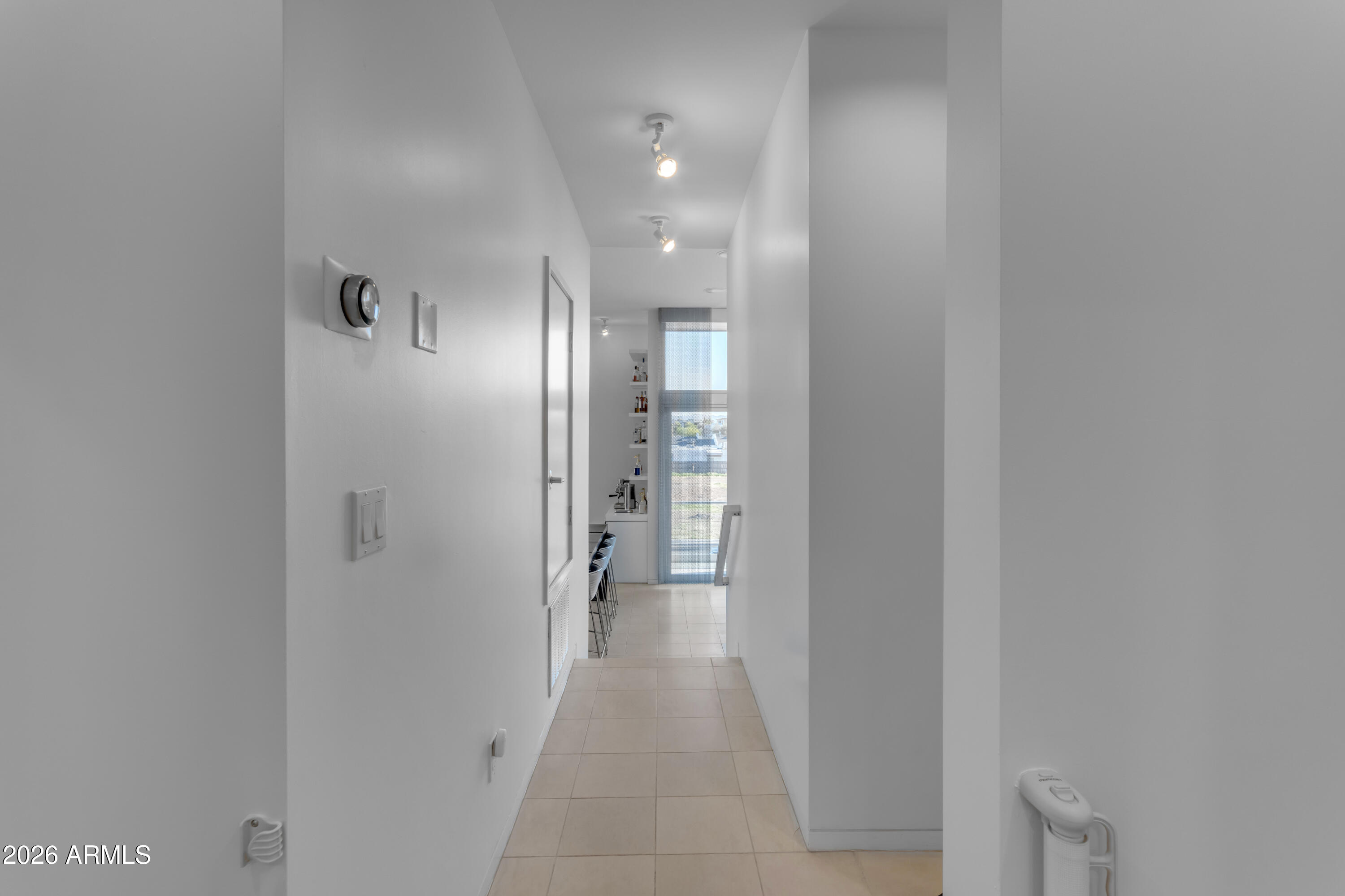 4410 North 27th Street, Unit 6 Phoenix, AZ 85016 - Photo 30 of 48 a view of a hallway with wooden shelves