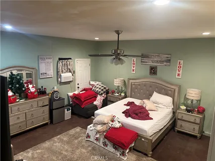 a bedroom with a bed and furniture