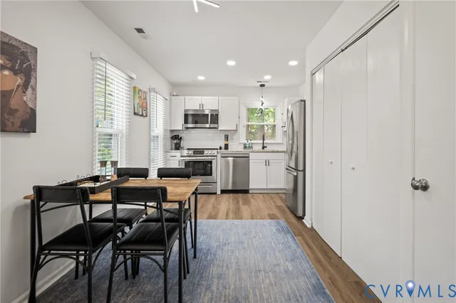 a stove top oven sitting inside of a kitchen