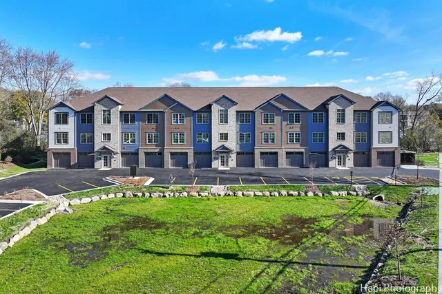 a front view of a house with a swimming pool