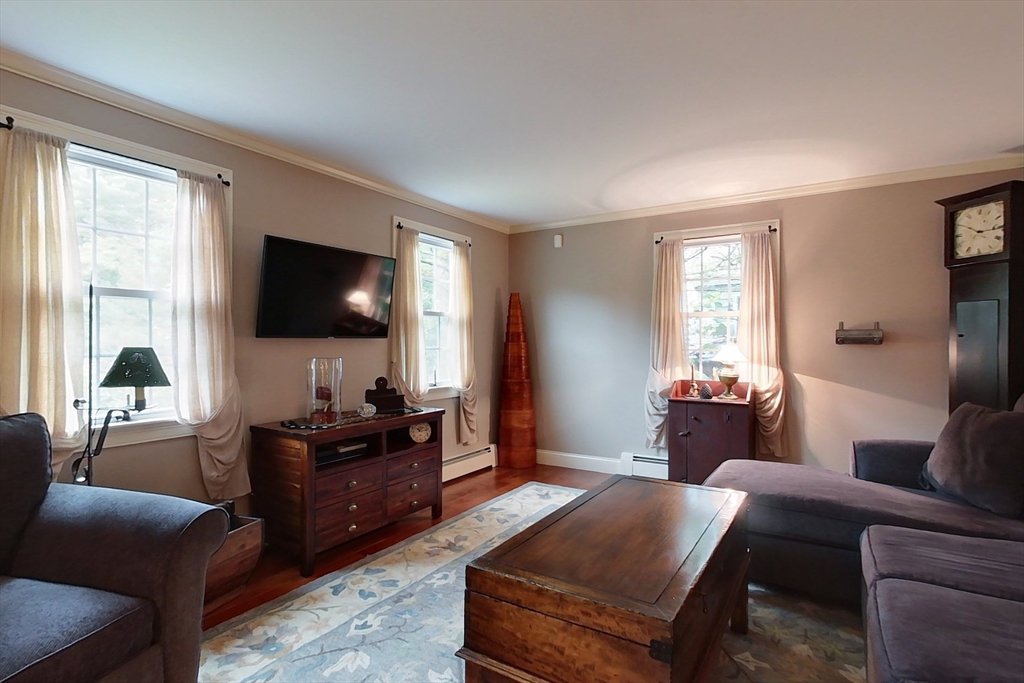 86 Turnpike Road Townsend, MA 01469 - Photo 11 of 42 a living room with furniture and a flat screen tv
