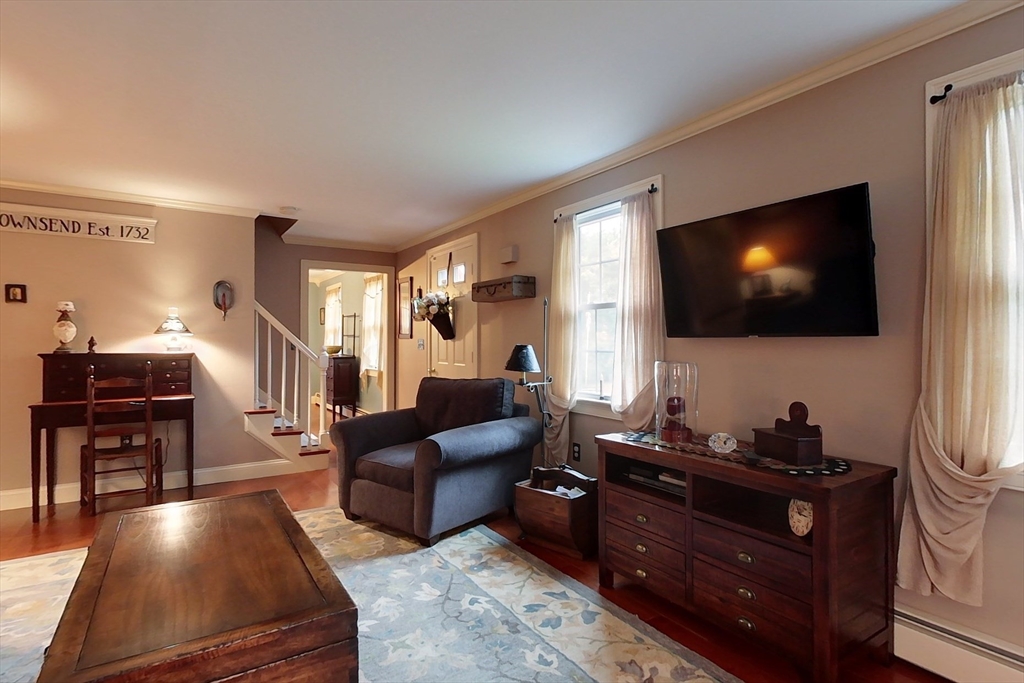 86 Turnpike Road Townsend, MA 01469 - Photo 12 of 42 a living room with furniture and a flat screen tv