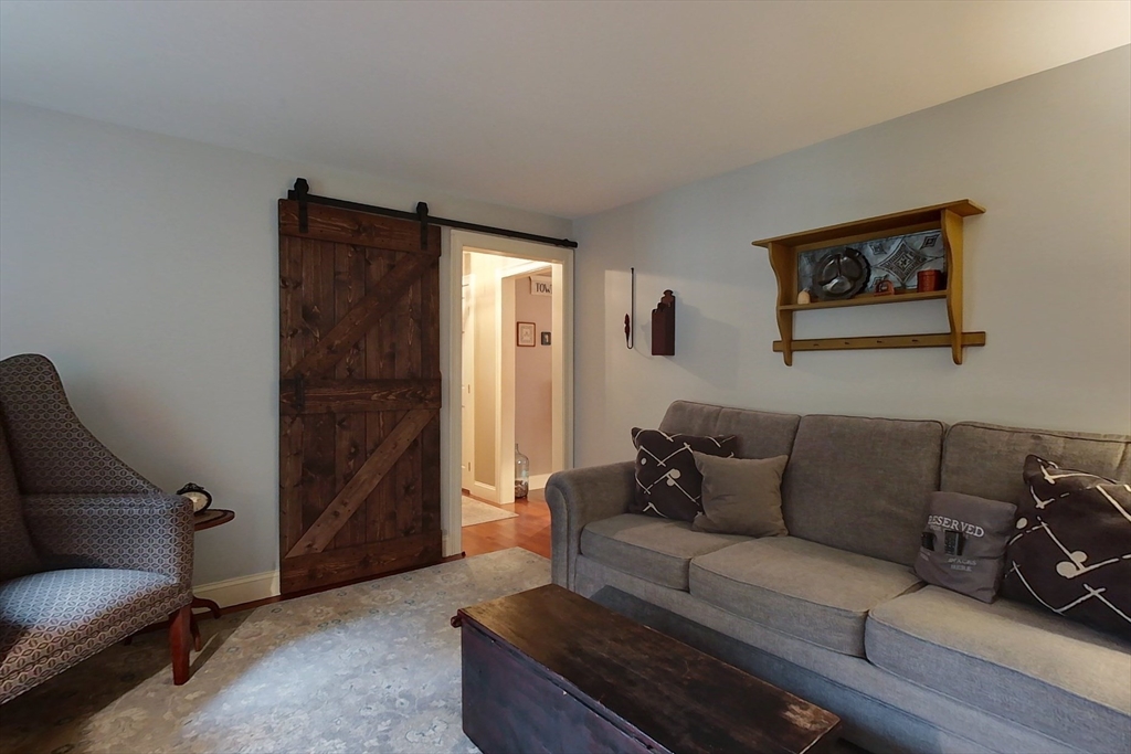 86 Turnpike Road Townsend, MA 01469 - Photo 15 of 42 a living room with furniture and a window