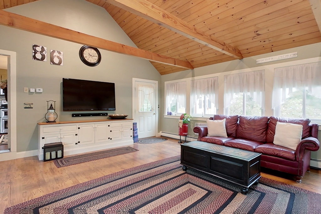 86 Turnpike Road Townsend, MA 01469 - Photo 16 of 42 a living room with furniture and a flat screen tv