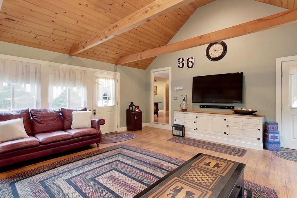 86 Turnpike Road Townsend, MA 01469 - Photo 17 of 42 a living room with furniture and a flat screen tv