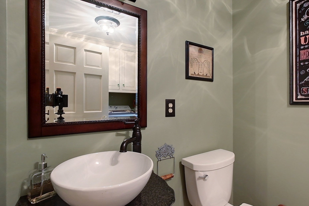 86 Turnpike Road Townsend, MA 01469 - Photo 19 of 42 a bathroom with a toilet a sink and mirror