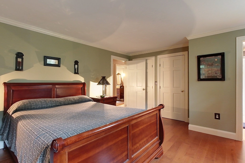 86 Turnpike Road Townsend, MA 01469 - Photo 20 of 42 a bedroom with a bed and wooden floor