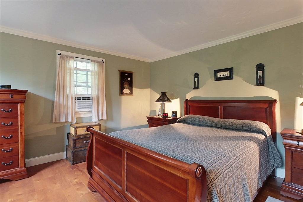 86 Turnpike Road Townsend, MA 01469 - Photo 21 of 42 a bedroom with a bed and wooden floor
