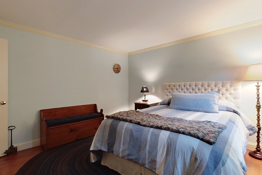 86 Turnpike Road Townsend, MA 01469 - Photo 24 of 42 a bedroom with a bed and a chair