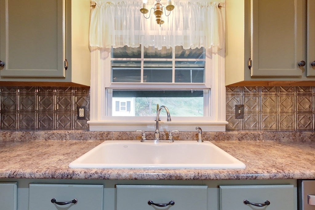 86 Turnpike Road Townsend, MA 01469 - Photo 3 of 42 a sink with granite countertop a sink and a window