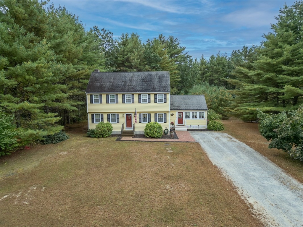 86 Turnpike Road Townsend, MA 01469 - Photo 37 of 42 front view of a house with a yard and balcony