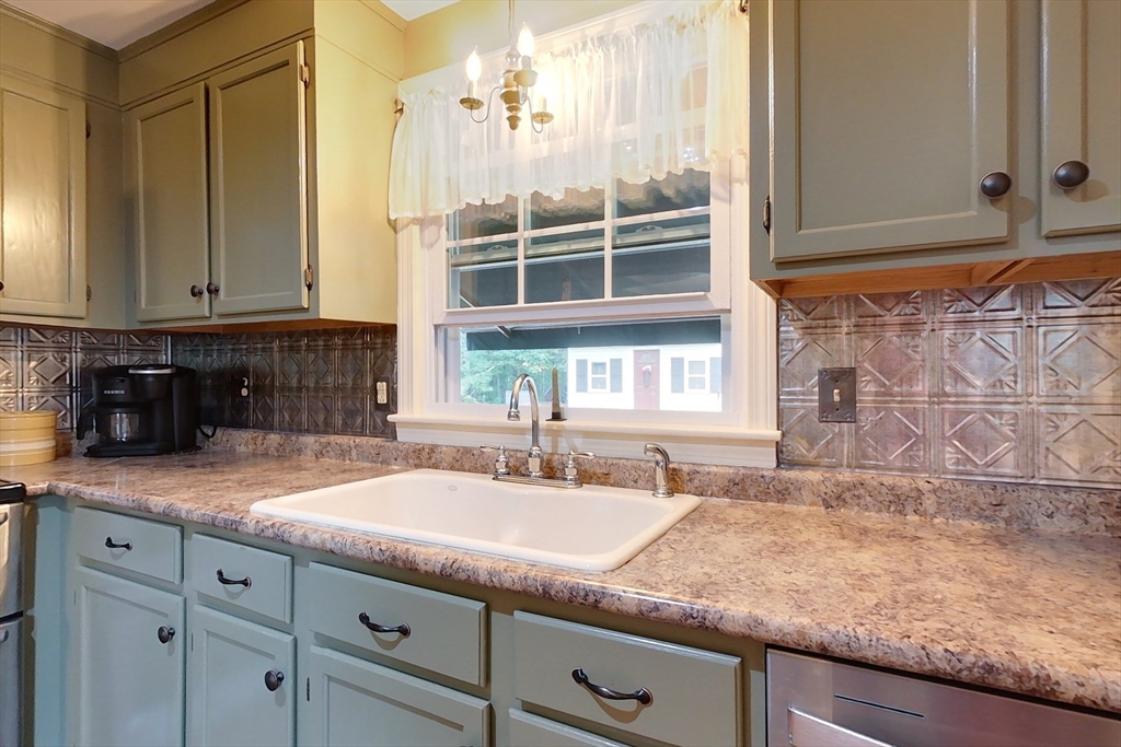 86 Turnpike Road Townsend, MA 01469 - Photo 4 of 42 a kitchen with granite countertop a sink and a window