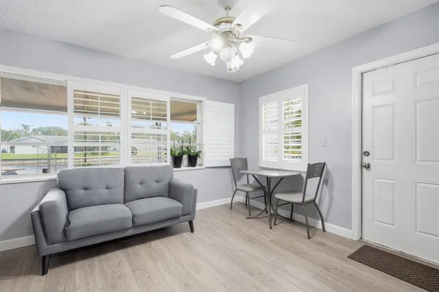 a living room with furniture and a large window