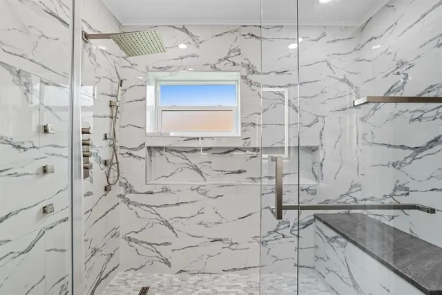 a bathroom with shower bathtub and sink