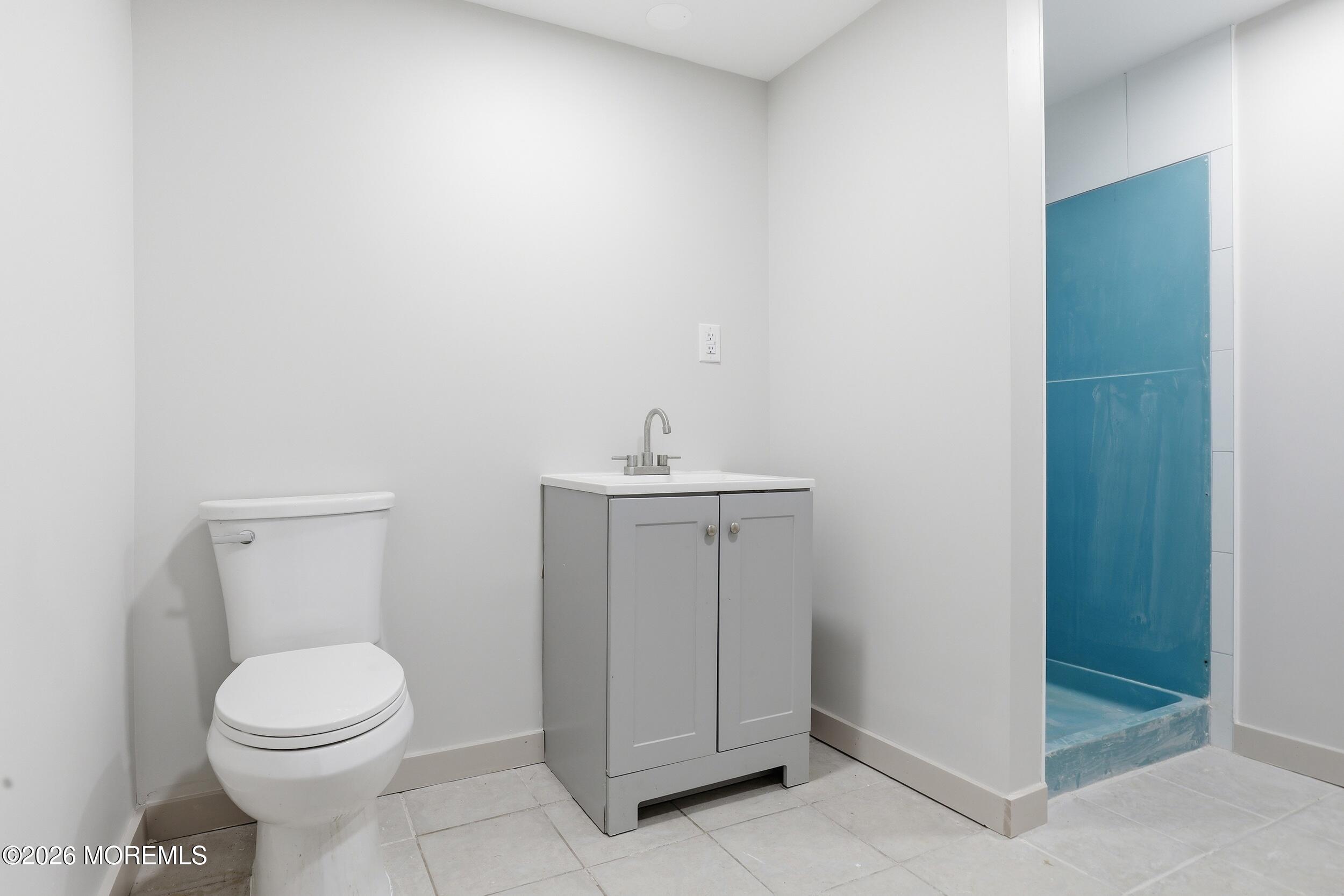 492 Cobain Road Jackson, NJ 08527 - Photo 39 of 47 a bathroom with a toilet sink and vanity