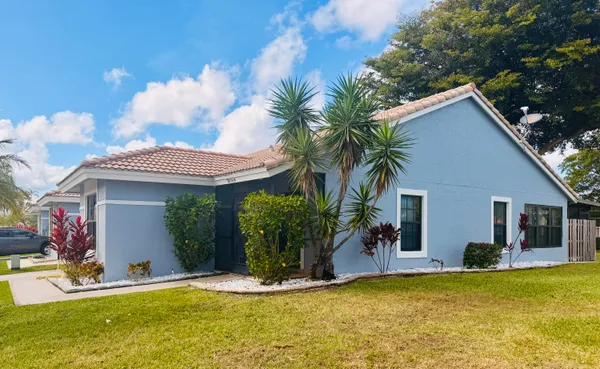 a view of a house with swimming pool and a porch