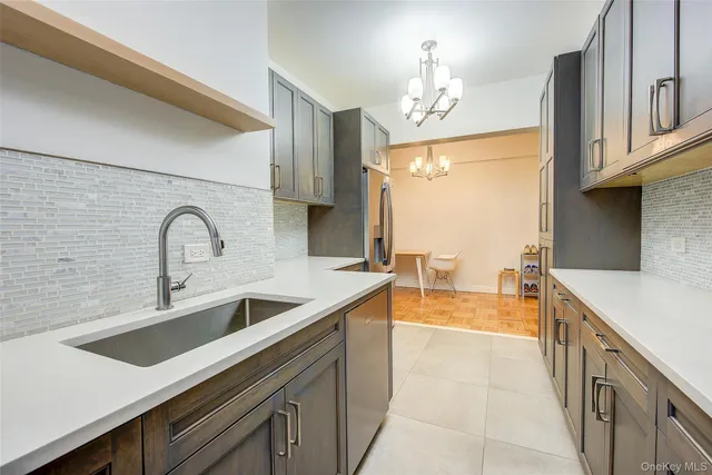 a kitchen with a sink and a refrigerator