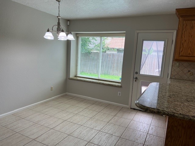 7407 Navidad Road Houston, TX 77083 - Photo 13 of 29 en empty room with wooden floor and windows