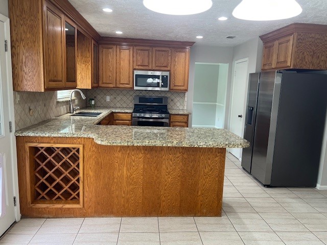 7407 Navidad Road Houston, TX 77083 - Photo 14 of 29 a kitchen with stainless steel appliances granite countertop a refrigerator and a sink