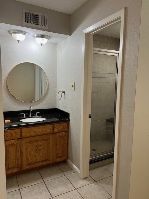 7407 Navidad Road Houston, TX 77083 - Photo 20 of 29 a bathroom with a granite countertop sink a mirror and bathtub