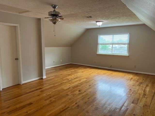 7407 Navidad Road Houston, TX 77083 - Photo 22 of 29 an empty room with wooden floor chandelier fan and windows