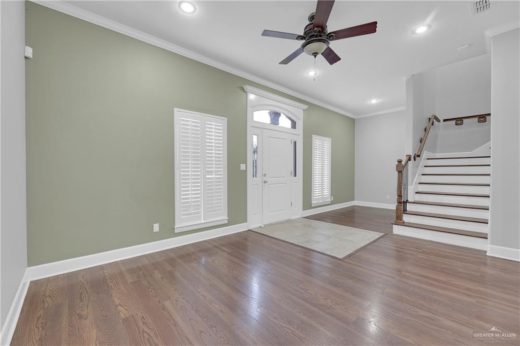209 Robin Avenue McAllen, TX 78504 - Photo 4 of 20 wooden floor in an empty room with a window