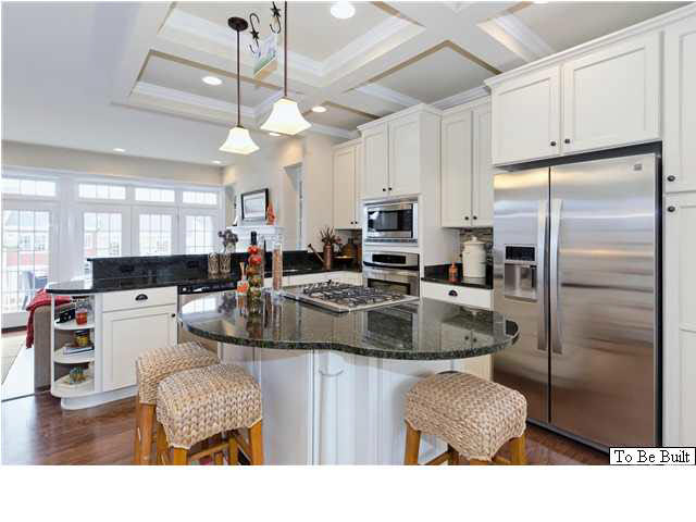 2028 Avinity Loop, Unit 50 Charlottesville, VA 22902 - Photo 6 of 21 a kitchen with stainless steel appliances granite countertop a refrigerator a stove a sink dishwasher a dining table and chairs with wooden floor
