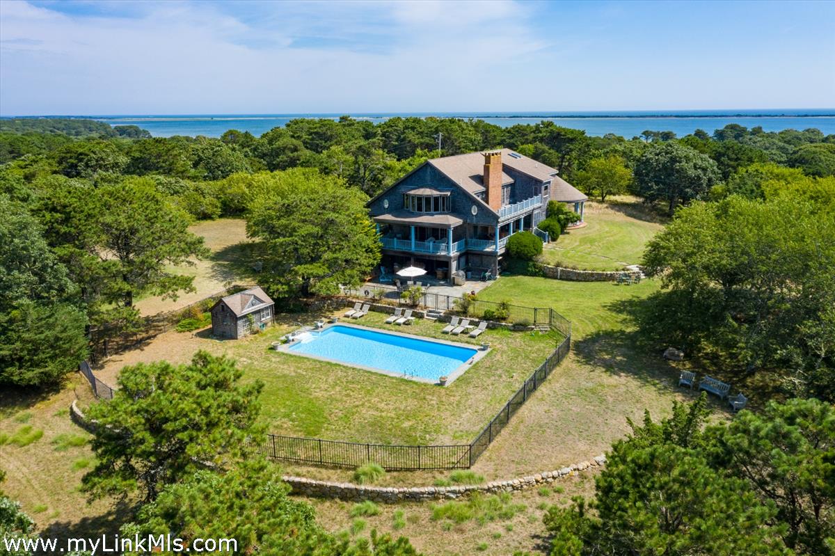 56 North Neck Road Edgartown, MA 02539 - Photo 59 of 63 a view of a house with a yard and potted plants