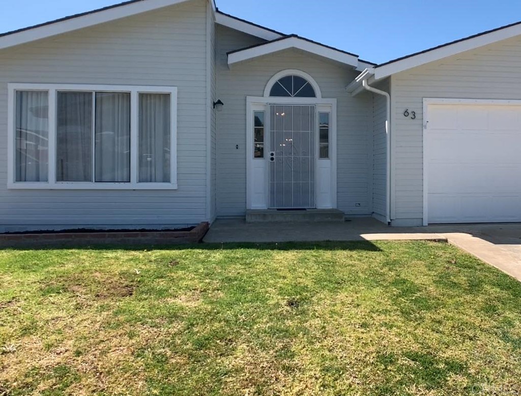 a view of a back yard of the house