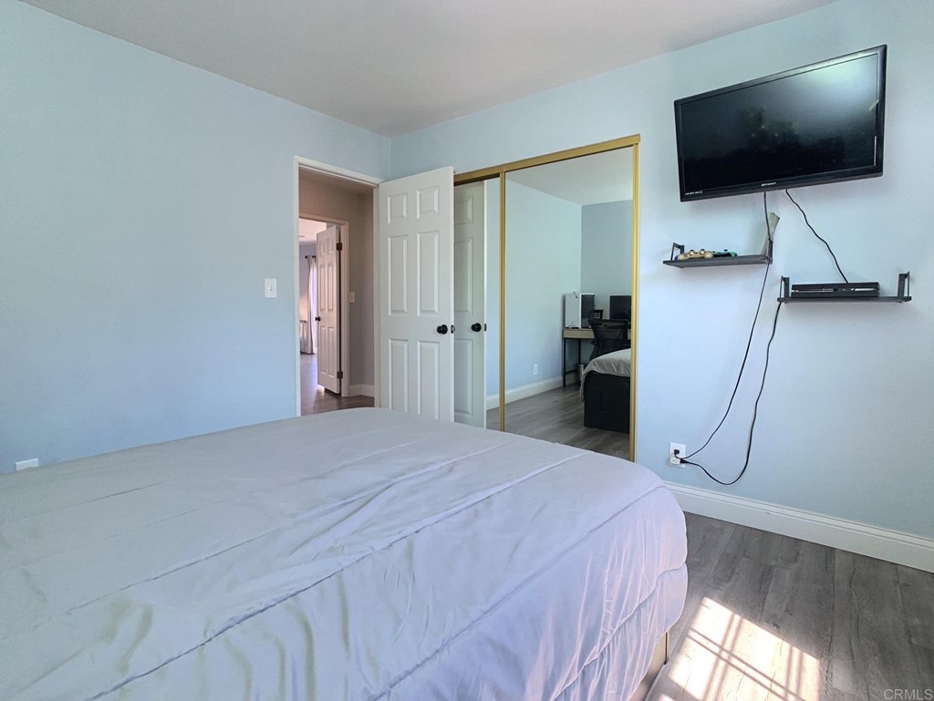 15935 Spring Oaks Road, Unit 63 El Cajon, CA 92021 - Photo 21 of 38 a room with a flat screen tv and a bathroom