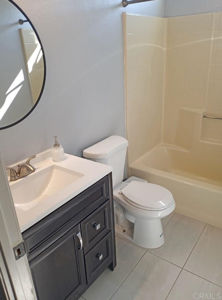 15935 Spring Oaks Road, Unit 63 El Cajon, CA 92021 - Photo 25 of 38 a bathroom with a sink toilet and shower