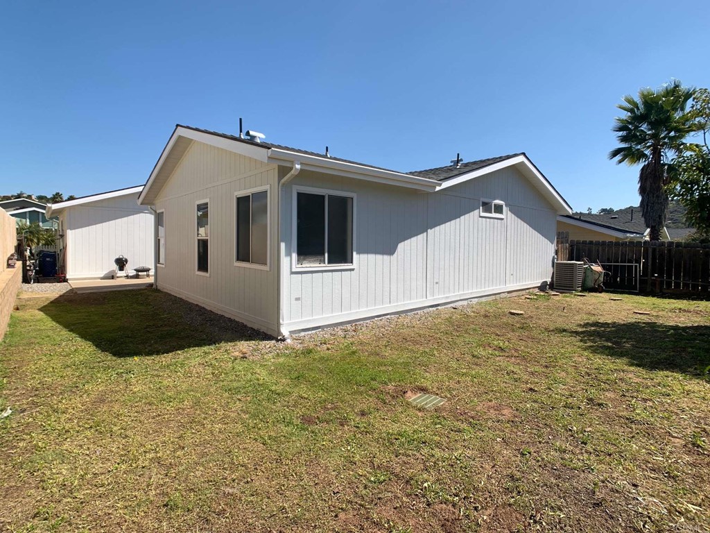 15935 Spring Oaks Road, Unit 63 El Cajon, CA 92021 - Photo 31 of 38 a view of a house with a yard