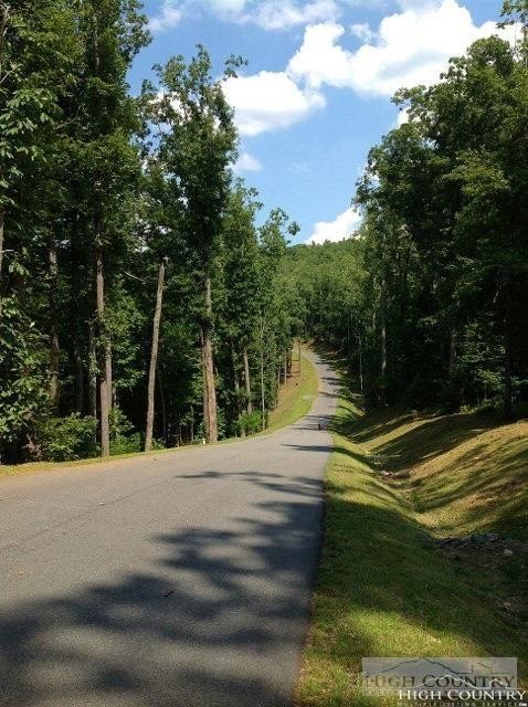 Lot 19 Boulder Cay Road Boone, NC 28607 - Photo 12 of 19 a view of a lake with a house in the background