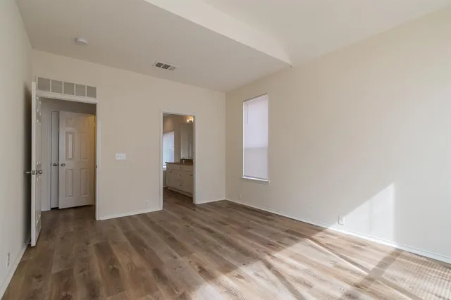a view of an empty room and window
