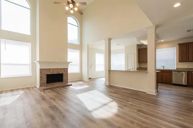 a view of a kitchen with a sink cabinets and a fireplace