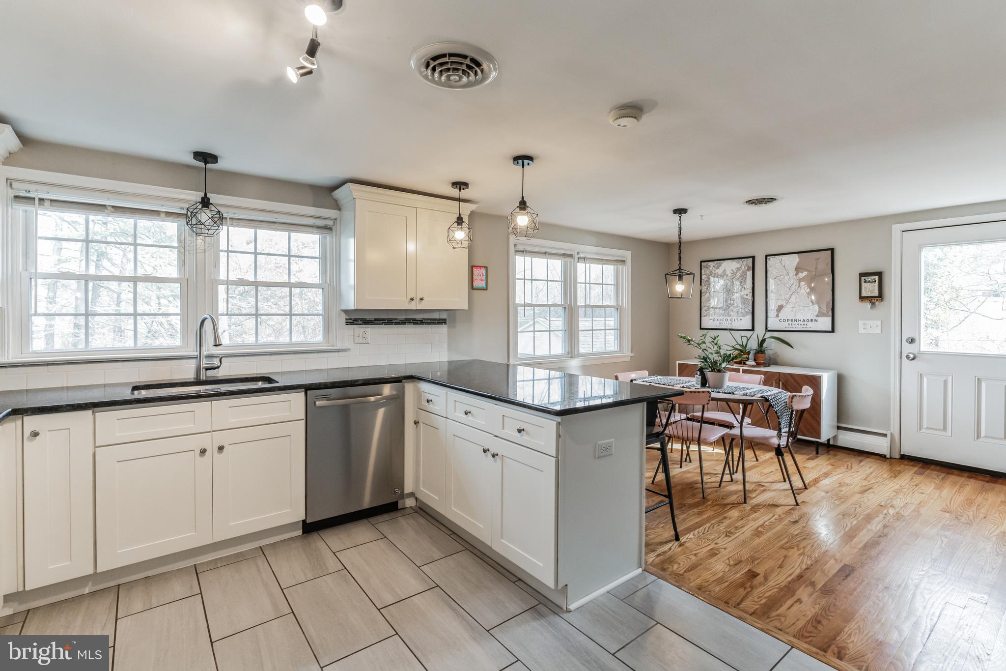 223 Stony Run Road Spring City, PA 19475 - Photo 13 of 30 a kitchen with granite countertop lots of white cabinets and wooden floor
