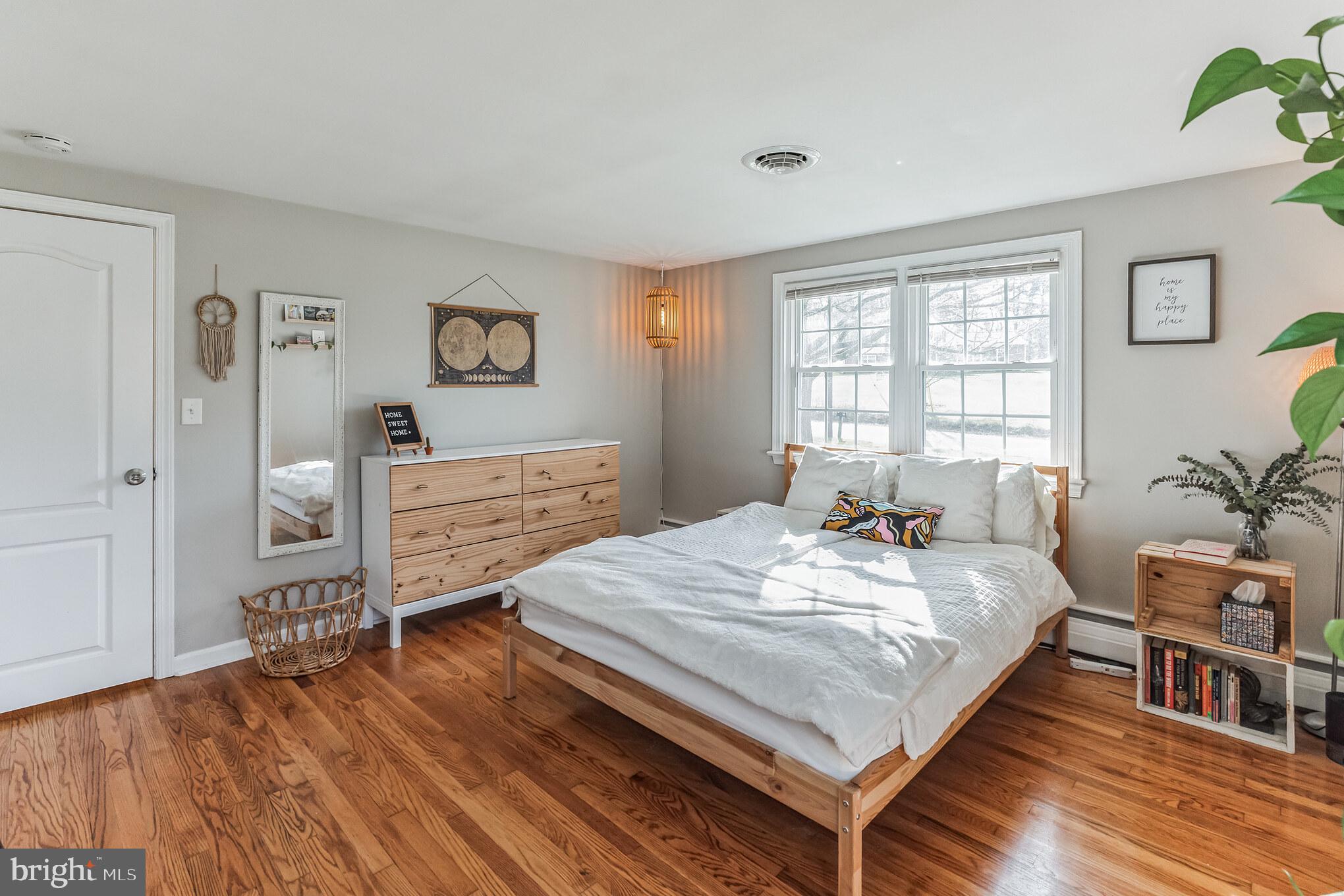 223 Stony Run Road Spring City, PA 19475 - Photo 16 of 30 a bedroom with a bed and wooden floor