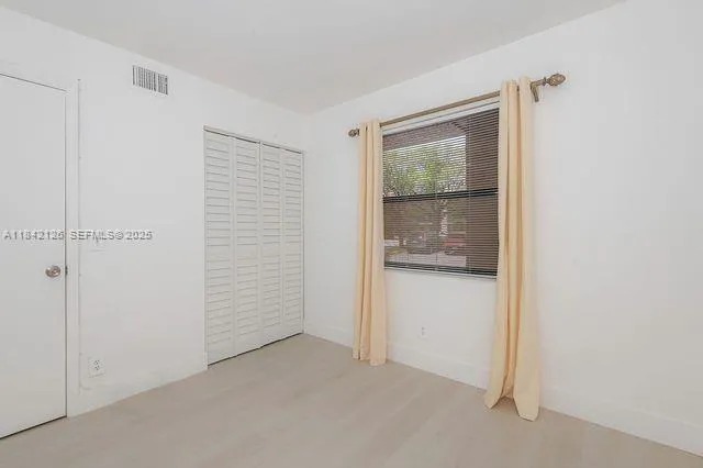 a view of an empty room with window