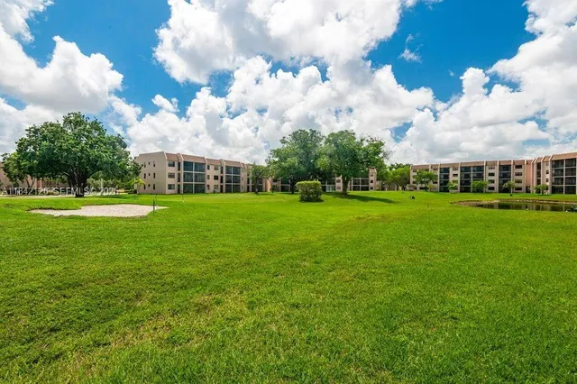 a view of a big yard with a fountain