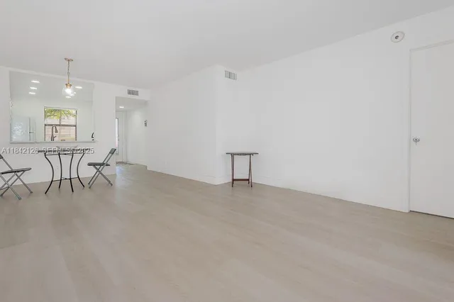 a view of a livingroom with furniture and wooden floor
