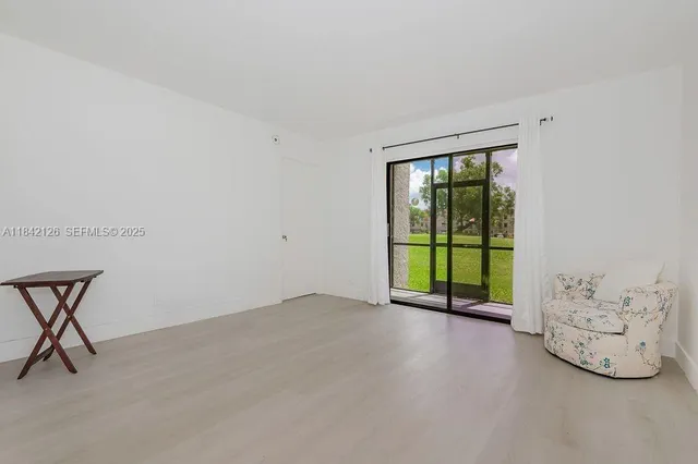 a view of a room with a large window